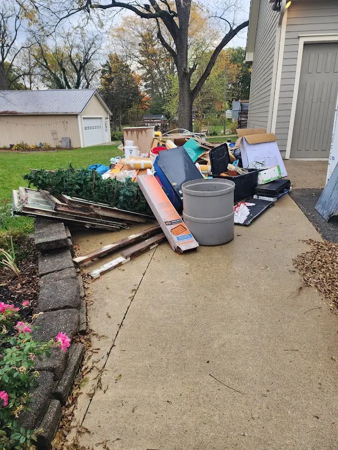 Dumpster being loaded with debris for Residential Dumpster Rental in Cottrellville